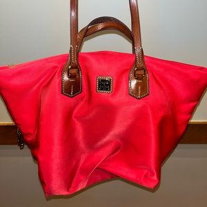 Used Dooney & Bourne red shoulder bag. Large tote size.